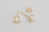 Gabrielle is a pair of fine pearl earrings made with 18k yellow gold and natural pearls.  Beyond elegant, this classic and delicate earring is adorned with natural pearls in a simple prong set design. They are sure to become your new favourite.