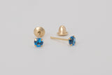 Èze is a pair of fine stud earrings made with 18k yellow gold and simulated sapphires.  Simple and elegant, these mini sapphire studs are one of our classic ear stack staples.