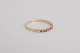 Cassis is a fine pavé ring made with 18k yellow gold and natural rubies.  Rubies have been long associated with power and wealth and not surprisingly, passion. This natural ruby pavé arc ring will brighten your day and stand the test of time. Looks beautiful both on it's own or layered with your other favourite gold rings.