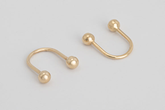 Grasse is a pair of fine hook earrings made with solid 18k yellow gold.  These solid gold hook earrings are edgy, elegant and minimal all at the same time. It's modern design is a twist on an everyday solid gold style.