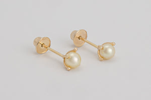 Gabrielle is a pair of fine pearl earrings made with 18k yellow gold and natural pearls.  Beyond elegant, this classic and delicate earring is adorned with natural pearls in a simple prong set design. They are sure to become your new favourite. 