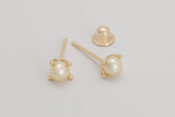 Gabrielle is a pair of fine pearl earrings made with 18k yellow gold and natural pearls.  Beyond elegant, this classic and delicate earring is adorned with natural pearls in a simple prong set design. They are sure to become your new favourite. 
