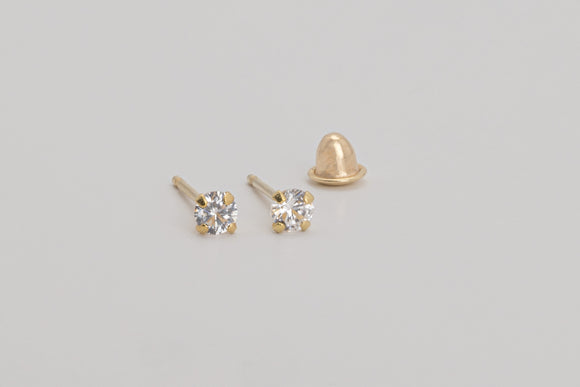 Aimee is a pair of fine stud earrings made with 18k yellow gold and simulated diamonds.  Simple and elegant, this mini brilliant stud is one of our classic ear stack staples.