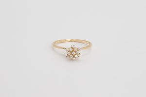 Le Bouquet is a fine bouquet ring made with 18k yellow gold and simulated diamonds.  Featuring a gorgeous flower design, this showstopper is a very feminine and delicate ring and it's the ultimate femme cocktail ring. Look no further if you are looking for that perfect piece to compliment your special occasion look.